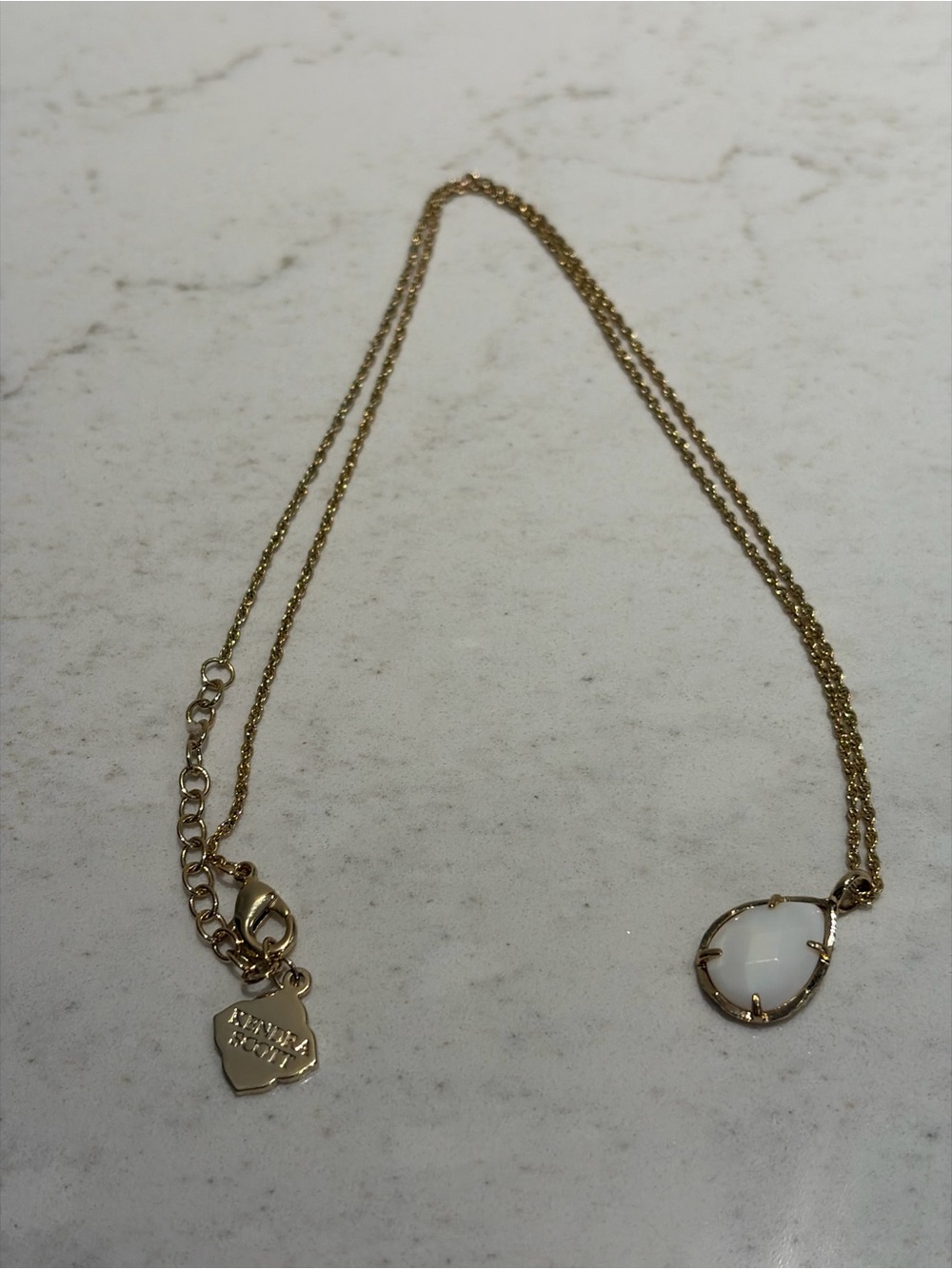Kendra Scott Gold Necklace with White Teardrop Pendant